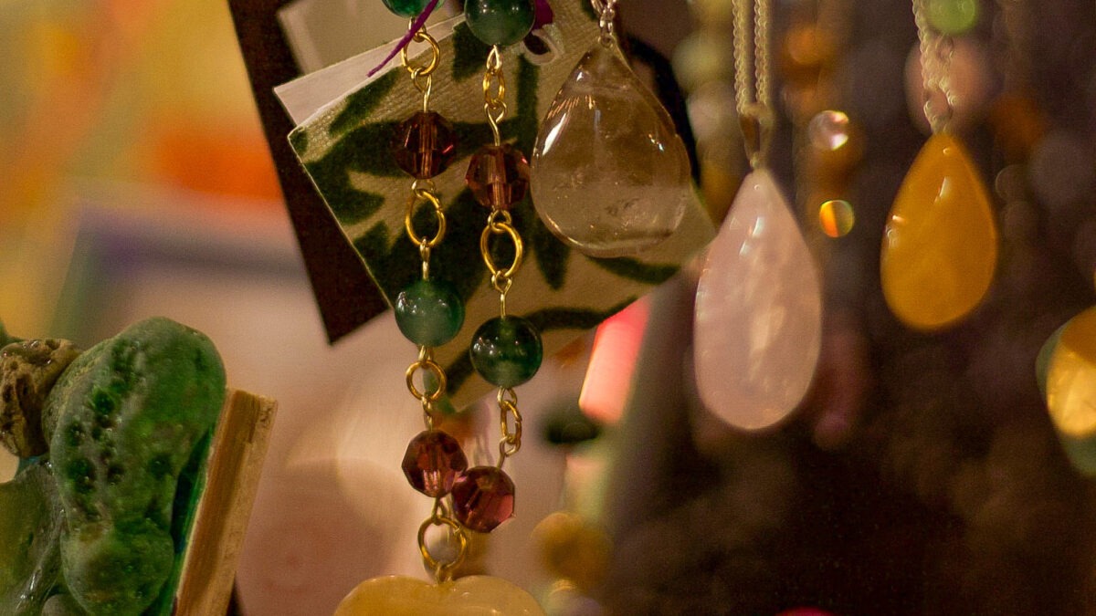 beaded necklaces, crystal pendants, and glass formations show layers of art types in this portfolio